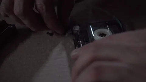 A man repairs an audio cassette Stock Footage 131564500