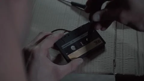 A man repairs an audio cassette Stock Footage 131564503
