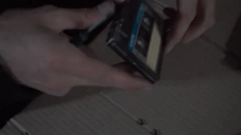 A man repairs an audio cassette Stock Footage 131564506