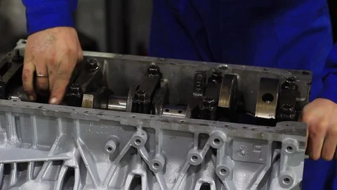 A man repairs car engine Stock Footage 104297440