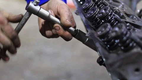 A man repairs car engine Stock Footage 104298057