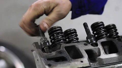 A man repairs car engine Stock Footage 205542820