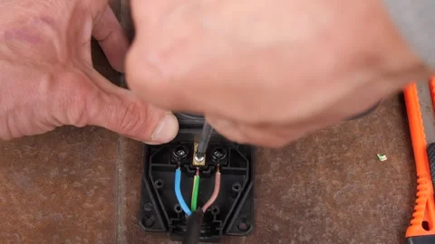 A Man Repairs A Electrical Socket Extension Cord 스톡 동영상 307631533