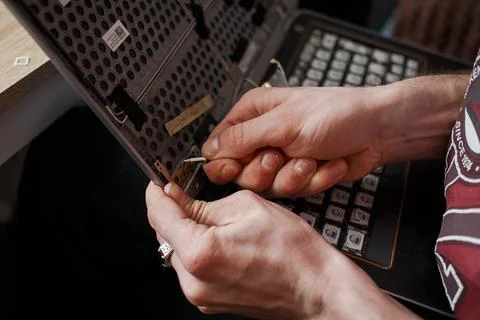 Man repairs laptop by himself, computer repair Stock Photos