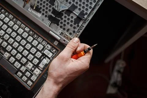 Man repairs laptop by himself, computer repair Stock Photos