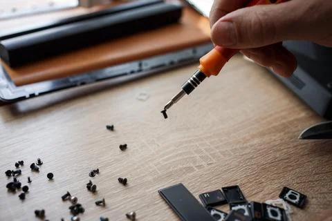Man repairs laptop by himself, computer repair 스톡 사진