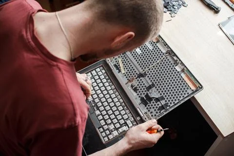 Man repairs laptop by himself, computer repair Stock Photos