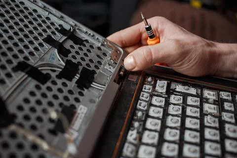 Man repairs laptop by himself, computer repair Stock Photos