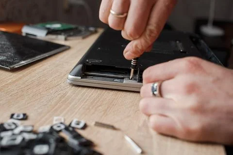 Man repairs laptop by himself, computer repair Stock Photos