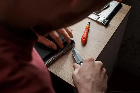 Man repairs laptop by himself, computer repair Stock Photos
