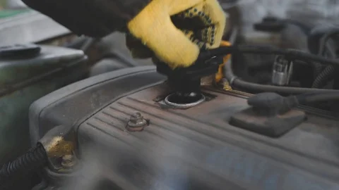 A man repairs an old rusty car Stock Footage 124946474