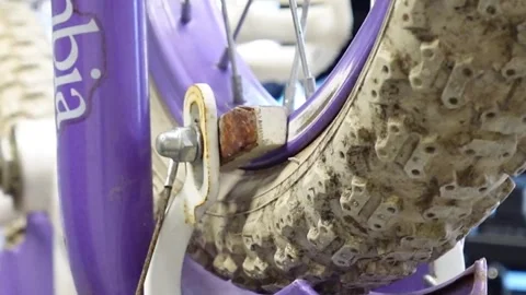 Man replacing brake pads on a bicycle San Francisco CA USA July 15 2025 Stock Footage 313171595