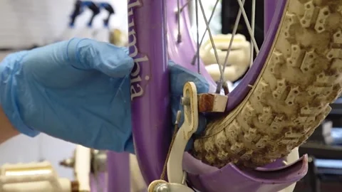 Man replacing brake pads on a bicycle San Francisco CA USA July 15 2025 Stock Footage 313171598