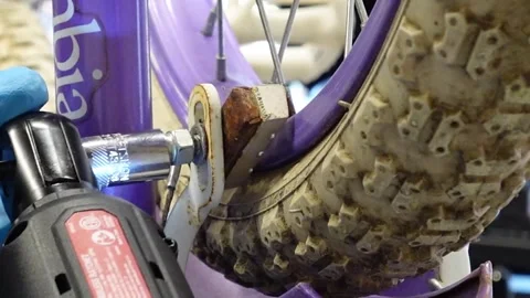 Man replacing brake pads on a bicycle San Francisco CA USA July 15 2025 Stock Footage 313171599
