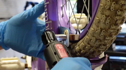 Man replacing brake pads on a bicycle San Francisco CA USA July 15 2025 Stock Footage 313171604
