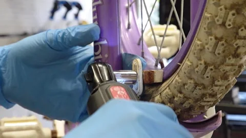 Man replacing brake pads on a bicycle San Francisco CA USA July 15 2025 Stock Footage 313171607