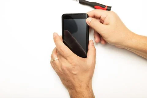 Man replacing a smartphone screen Stock Photos