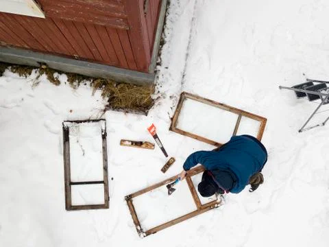 Man replcing old windows 写真素材