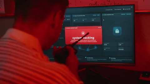 Man Reporting System Hacking Alert on Computer with Radio Stock Footage 346818535