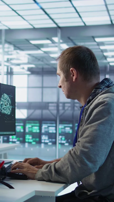 Man requesting help from coworkers after finding bug in data center systems Stock Footage 319574162