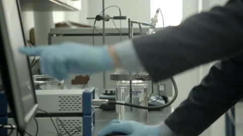 Man In Research Lab Pointing At Computer Stock-Footage 65008572