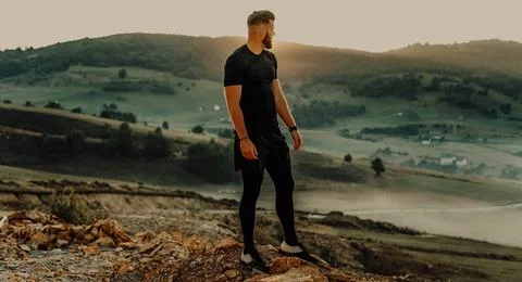 Man rest on top of mountain after training.Motivation concept Fotos de archivo