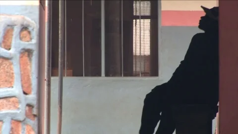 Man resting in an administration corridor Stock Footage 80424726