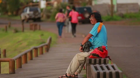 Man resting on a bench in Easter Island Stock Footage 64872403