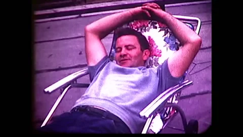Man resting on Chaise with cat and dog shots 1960s 8mm  Stock Footage 151655412