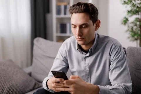 Man resting on couch with tablet Stock-Fotos
