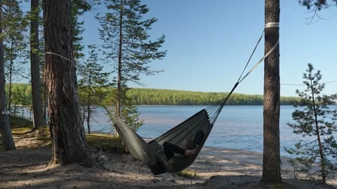 Man resting in hammock Video stock 287476583