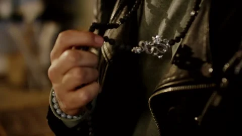 Man Resting Hand on Black Leather Jacket, Studded Bracelet, Close Up Shot Stock Footage 341301546