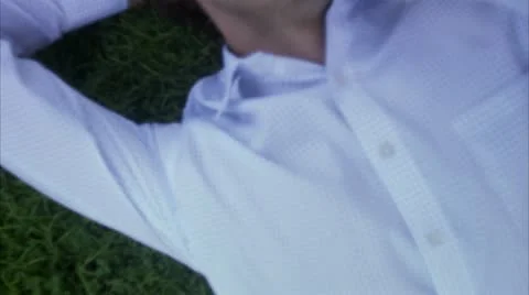 A man resting in a park using a mobil phone Stock Footage 11288240