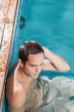 Man resting in the pool Stock Photos