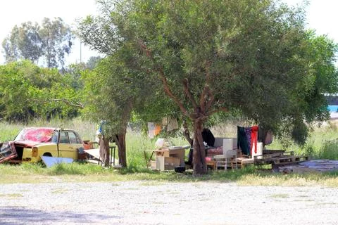 A man is resting under a tree Stock Photos