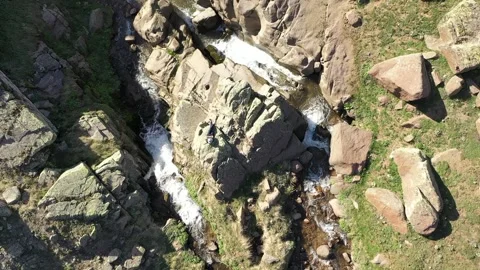 Man resting by waterfall on aerial view Stock Footage 294166573