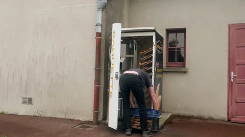 Man restocking baguette vending machine. Normandy, France. Stock Footage 218257422