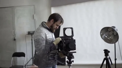 Man with retro camera Stock Footage 72104779