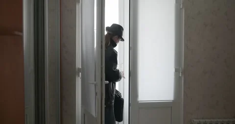 Man Returning Home. Undress Winter Attire. 4K 10-bit Stock Footage 322547279