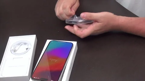 A man reviews a silicone case and protective cover for a smartphone. Remove.. Stock Footage 277481933