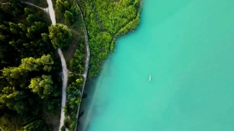Man ride on SUP board in the mountain lake Stock Footage 203964033