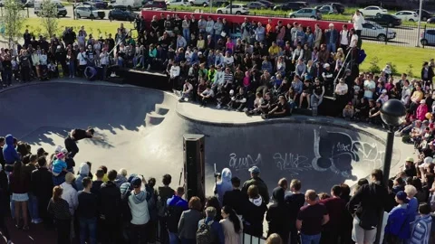 Man rides and falls down from skateboard in skatepark pool Stock Footage 130878610