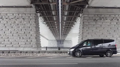 Man rides and stops in black car on road under Stock Footage 299678712