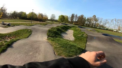 Man rides a Asphalt Pumptrack on Inline Skates POV Stock-Footage 120445385