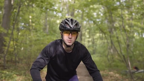 Man Rides Bicycle in the Forest Stock-Footage 75564300