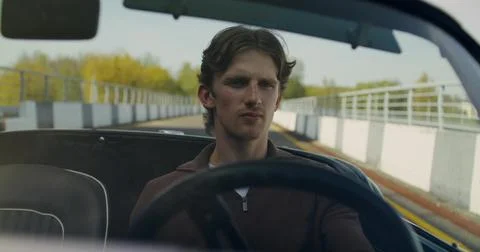 A man rides in a convertible Stock Photos