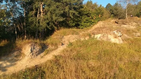 Man rides on downhill mtb through the rocks. Stock Footage 83734483