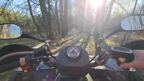 A man rides fast on an ATV through the forest Stock-Footage 194160667