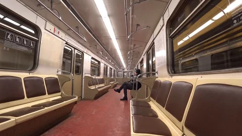 Man rides in a glowing empty subway car in the tunnel Stock Footage 85701160