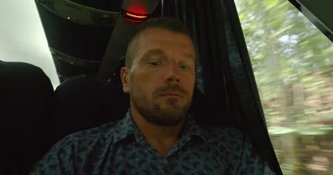 Man rides in a intercity comfortable bus looking out the window, swaying. Stock Footage 249353152